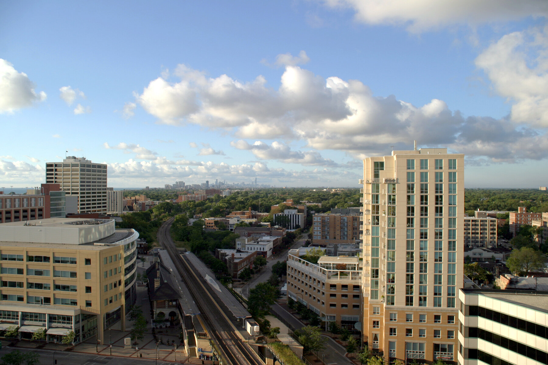 Chicago skyline and commercial buildings across the All One Exteriors service area